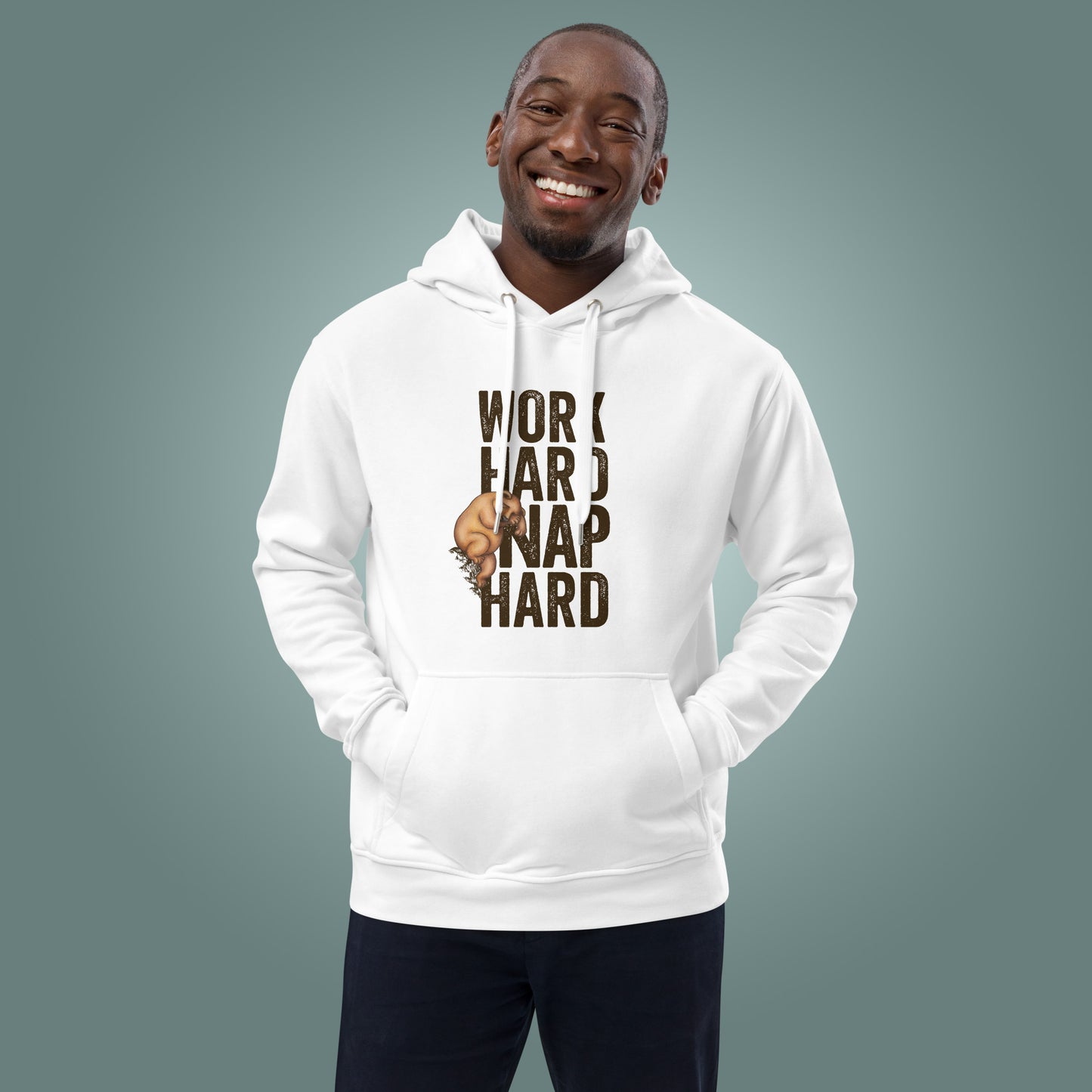 Man wearing a white hoodie with "Work Nap Hard" design on a teal background