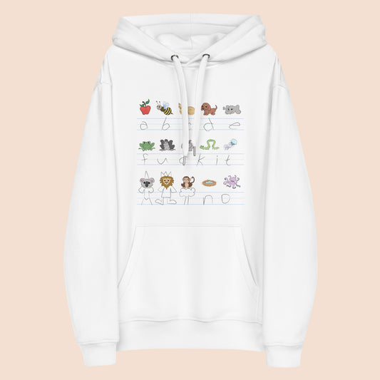White hoodie with handwritten alphabet text (with a surprise) and colourful animal illustrations on a peachy beige background