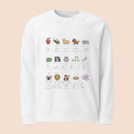 White sweatshirt with handwritten alphabet text (featuring a surprise) and colourful animal illustrations on a peachy beige background