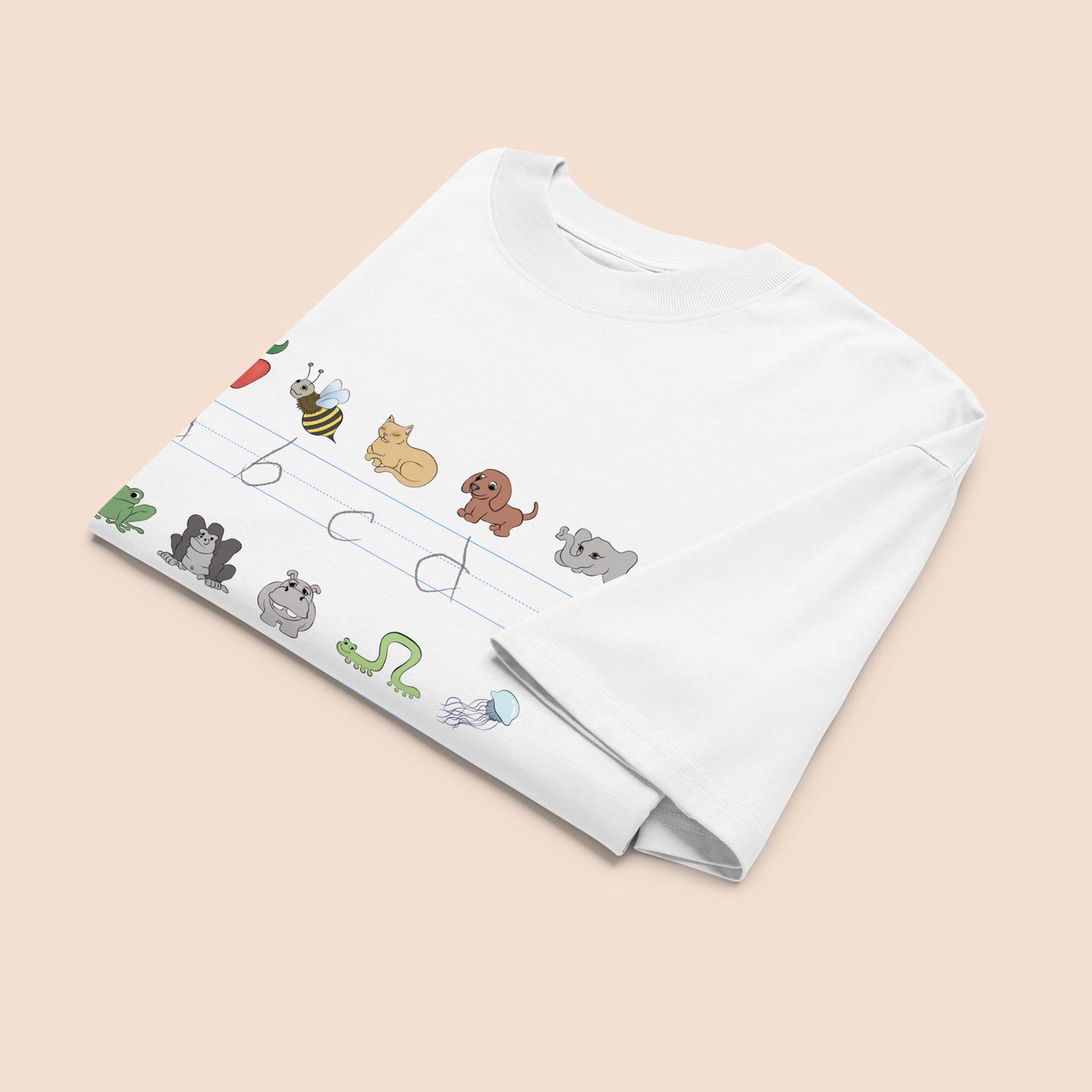 White t-shirt with cartoon animal illustrations and part of an alphabet on a peachy beige background