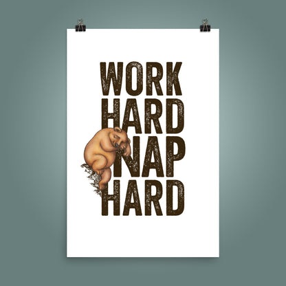24 inch by 36 inch poster with bold, upper case 'Work Hard Nap Hard' text and a cute  illustration of a sleepy bear on a plain white surface, with a teal wall behind the poster