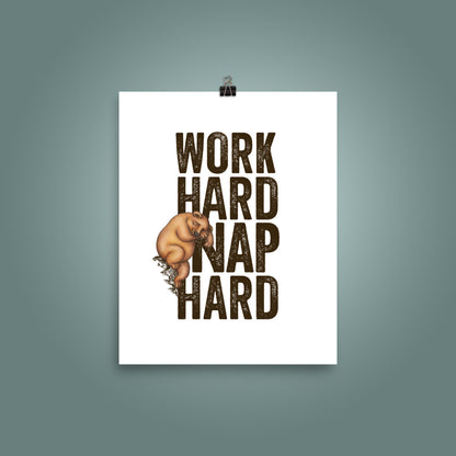 8 inch by 10 inch poster with bold, upper case 'Work Hard Nap Hard' text and a cute  illustration of a sleepy bear on a plain white surface, with a teal wall behind the poster